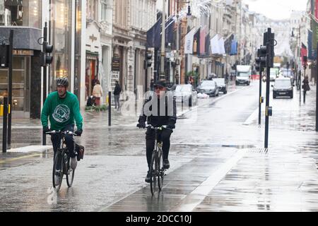 London, UK, 19 November 2020: During lockdown some people walk, cycle and run in London's almost deserted West End for exercise. Anna Watson/Alamy Live News Stock Photo