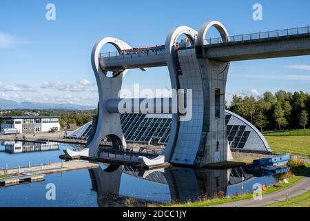 Canal boat entering the top of the Falkirk Wheel rotating boat lift in Falkirk, Scotland, UK Stock Photo