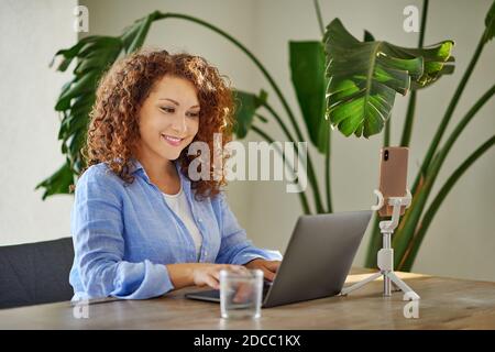 Female professional working on a laptop Stock Photo