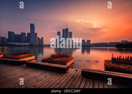 sunset over Swan Lake financial business district, Hefei city, China