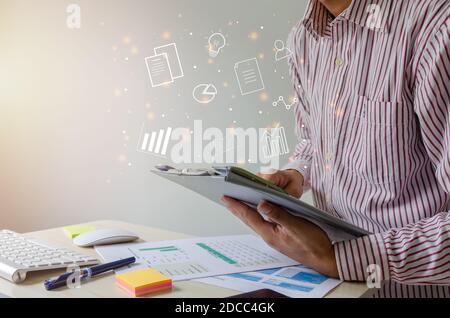 businessmen look at file information, financial reports and business analysis.Business concept creative ideas icon. Stock Photo