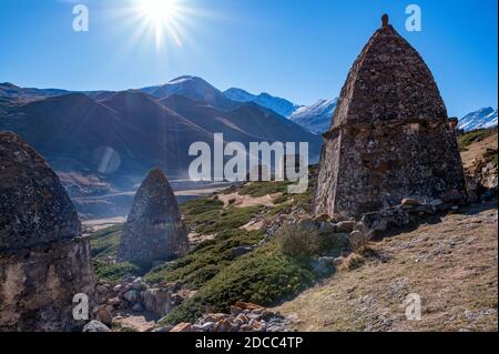 Tree and medieval tombs in City of Dead near Eltyulbyu, Russia Stock Photo