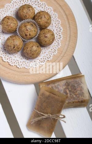 Dried fruit and oatmeal sweets. Homemade Nut & Dried Fruit Energy Bars. Wrapped in paper and tied with twine. Stock Photo