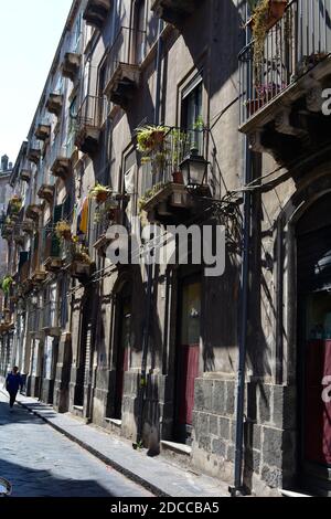 Man walking along a street in Catania, Sicily Stock Photo