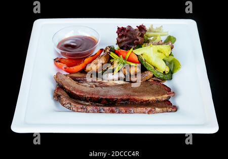 Meat steak with grilled vegetables daddy sauce  Stock Photo