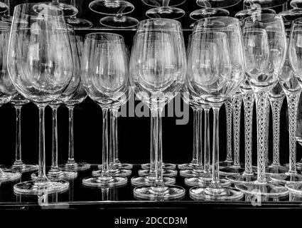 group of empty clean wine glasses on the bar shelf Stock Photo