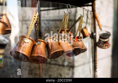Sale of traditional Turkish Turks for making coffee at the Turkish market in Istanbul Stock Photo
