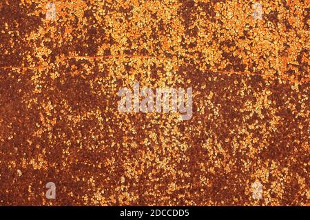 Weathered and rusty metal background. Old iron wall. Worn metal panel. Rusted metal texture Stock Photo
