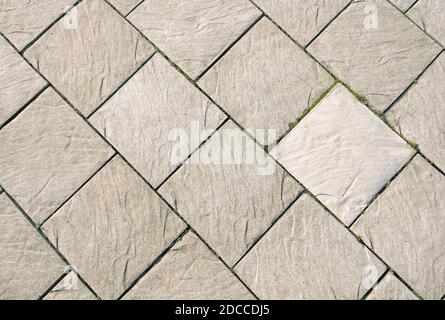 Grey square tiles. Paved footpath. Abstract background Stock Photo