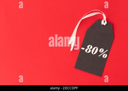Black Friday. Sale tag over red background Copy space. Stock Photo