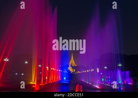 Public Square People's Park with lit illuminated water fountains and Shwedagon Pagoda, Yangon, Myanmar (Burma), Asia in February Stock Photo