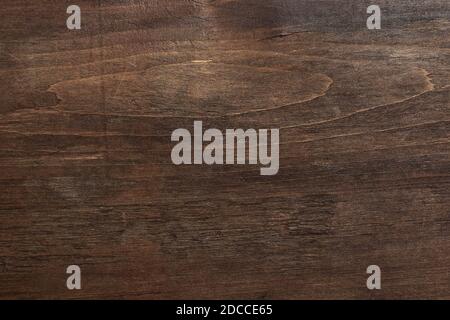 Shabby wood texture. Dark brown wooden background. Scratched wooden wall. Stock Photo