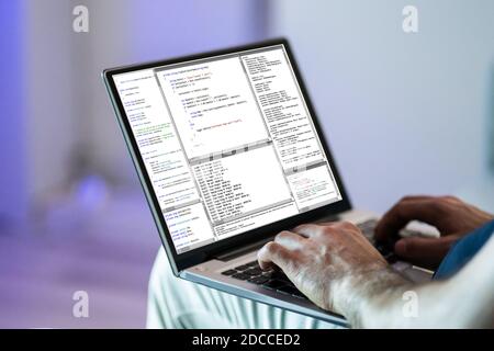 Software Developer Programmer Working On Laptop Computer Stock Photo