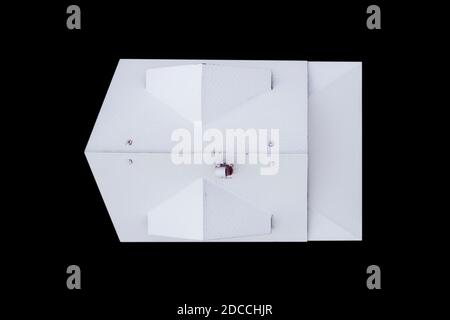 Aerial view house roof shingles covered with frost. Snow covered soft tile roof of the house isolated on black background. Top view Stock Photo