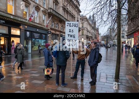 Glasgow, Scotland, UK. 20th November, 2020. A man standing in Buchanan Street holding a sign saying Jesus Is The Only Way as level four lockdown restrictions start today in eleven council areas. Credit: Skully/Alamy Live News Stock Photo