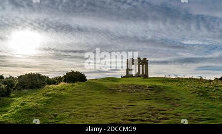 STONEHAVEN ABERDEENSHIRE SCOTLAND CLASSICAL WAR MEMORIAL WITH INSCRIPTIONS  ON A GRASS COVERED HILL OVERLOOKING THE TOWN AND HARBOUR Stock Photo