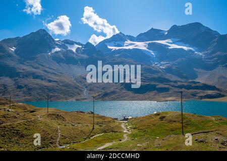 Looking over Lago Bianco, together with Lej Nair and Lej Pitschen one of three lakes at The Bernina Pass. It connects Engadin valley with Poschiavo Stock Photo