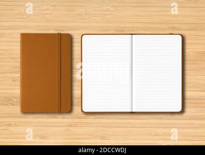 Leather closed and open lined notebooks mockup isolated on wooden background Stock Photo