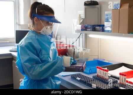 Campobasso, Molise, Italy: A nurse from the molecular biology analysis laboratory of the Cardarelli hospital, dressed in protective coveralls and mask Stock Photo