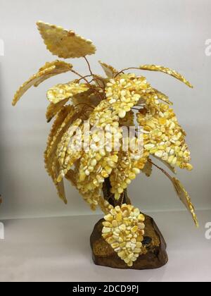 Handmade souvenir tree made of many small pieces of natural Baltic amber  Stock Photo