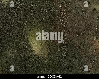 View through a window with small and big water drops Stock Photo