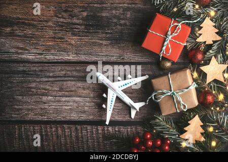 Christmas travel background. model of an airplane with a festive stocking  Stock Photo - Alamy