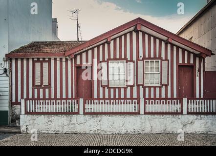 Tradittional fishermen's colorful houses in Costa Nova, Aveiro, Portugal. Tourism atraction. Red stripes Stock Photo