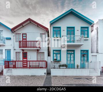 Tradittional fishermen's colorful houses in Costa Nova, Aveiro, Portugal. Tourism atraction. Red, green and blue stripes Stock Photo