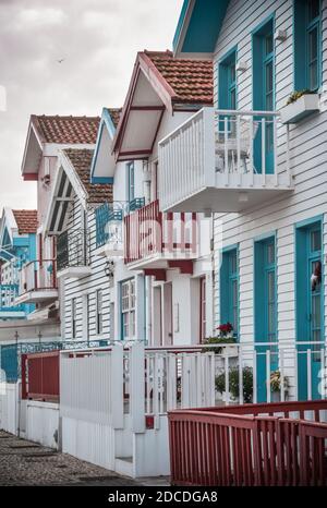 Tradittional fishermen's colorful houses in Costa Nova, Aveiro, Portugal. Tourism atraction. Red, green and blue stripes Stock Photo