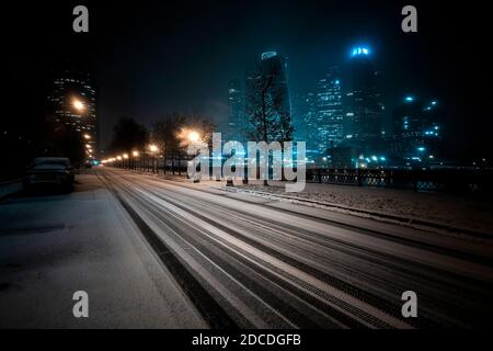 Moscow/Russia - November 20, 2020: Landscape of Moscow City with a winter snow-covered road at night. Dark exposure Stock Photo