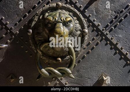 Door knocker and knob in shape of a lion's head, portal of the Dresden Royal Residential Palace, Saxony, Germany. Stock Photo
