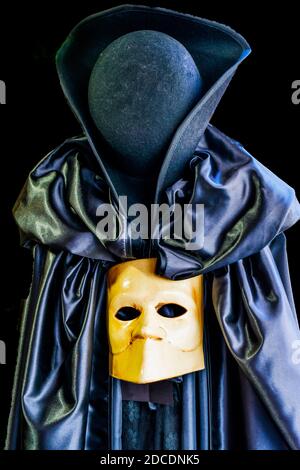 Traditional Venetian mask, black cape and hat, Venice, Italy. Used ...