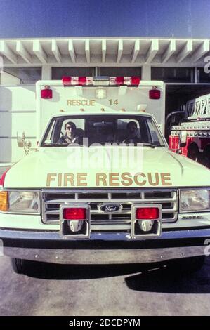 EMT vehicle parked in front of the fire station in Tampa, Florida  1980s Stock Photo