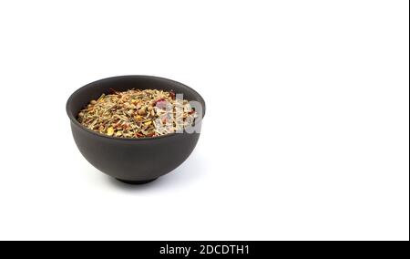 A set of condiments for cooking in a brown Cup on a white background. Stock Photo