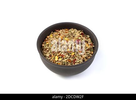 A mixture of different seasonings in a brown Cup on a white background. Stock Photo