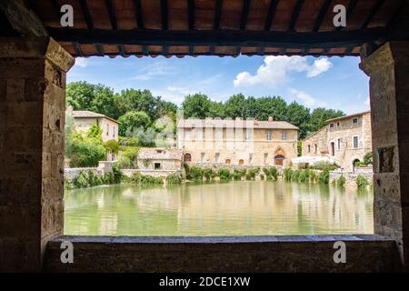 At Bagno Vignoni - Italy - On august 2020 - the square of the town with a central pool of hot thermal water Stock Photo