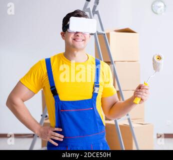 The painter contractor working with virtual reality goggles Stock Photo