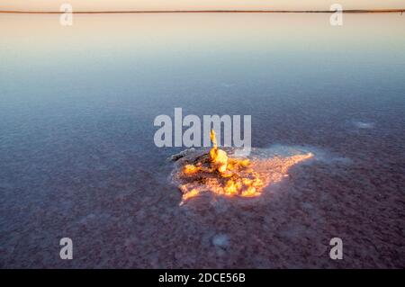 Shallow waters cover the hard salt pan of Lake Tyrrell in the Mallee region of northwest Victoria, Australia, which covers 180 square km Stock Photo