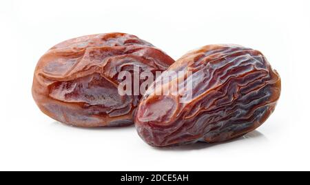 two juicy soft dried dates macro isolated on white background Stock Photo