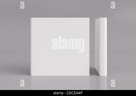 Two hardcover  square white mockup books standing on the white background. Blank front cover and spine of book Stock Photo