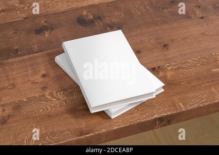 Vertical white hardcover book stack mockup on the wooden table Stock Photo