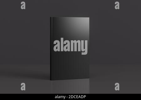 Hardcover vertical black mockup book standing on the black background Stock Photo