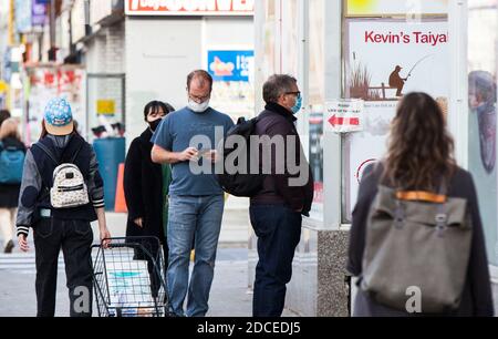 Toronto, Canada. 20th Nov, 2020. People wearing face masks line up to enter a supermarket in Toronto, Canada, on Nov. 20, 2020. Canadian Prime Minister Justin Trudeau said on Friday that the country is at stake as COVID-19 has been worsening. As of Friday afternoon, Canada reported a total of 319,038 cases and 11,313 deaths. Credit: Zou Zheng/Xinhua/Alamy Live News Stock Photo