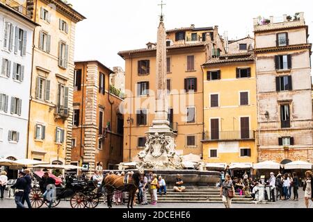 Tourists gathered around Fontana del Pantheon in Piazza della Rotunda in Rome Italy Stock Photo