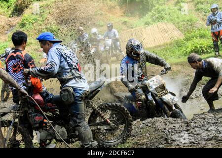 A Jember Adventure Trail participant demonstrates his motocross skills.  Jember Adventure Trail is an annual event Stock Photo - Alamy