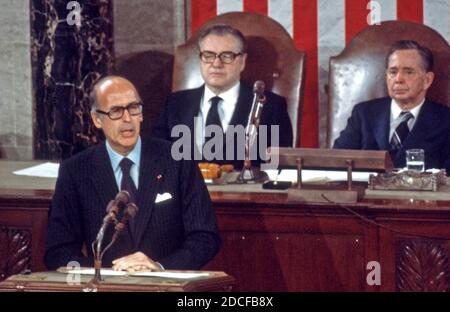 President Valéry Giscard d'Estaing of France, addresses a joint session of Congress in the US House Chamber in the US Capitol in Washington, DC on May 18, 1976. President Giscard d'Estaing is in Washington for a State Visit.  Seated behind President Giscard at right are US Vice President Nelson A. Rockefeller and Speaker of the US House of Representatives Carl Albert (Democrat of Oklahoma).Credit: Benjamin E. 'Gene' Forte / CNP /MediaPunch Stock Photo