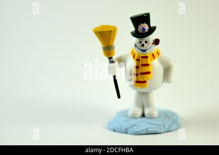 Snowman with a Hat and Broom Stock Photo