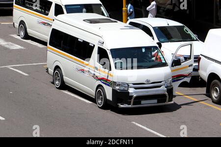 South african taxi cab double parked on city street Stock Photo