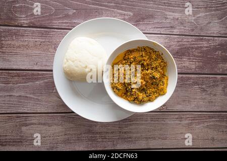 Bowl of Pounded Yam served with Egusi - Melon Soup Stock Photo