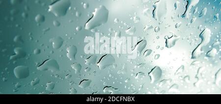 Banner of selective focus on raindrops on a window after a storm Stock Photo